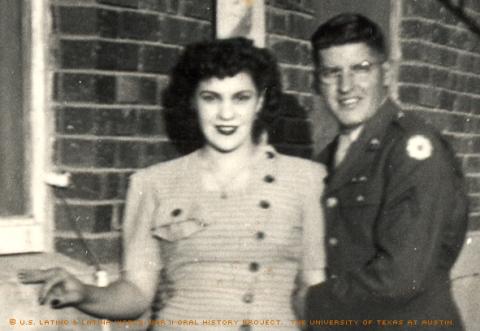 Albert Armendariz, Sr. and his wife, Mary Lou Armendariz. Photo taken El Paso, Texas between the years 1943-1947. --  The back of the photo reads,\He's got a good grip on me, huh? Looks like I was trying to run away.\""