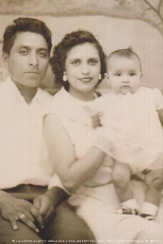 Paul Ybarra at a carnival with his wife Irene Jaramillo and their first daughter, Veronica. Wellington, Kansas, 1953.