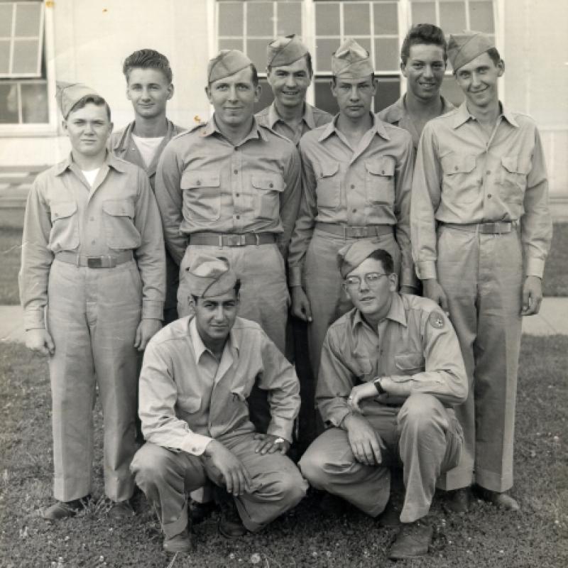 Joe (left kneeling down).  The picture was taken early in 1946 at Scott, Field, in Villerville, Illinois-now called Scott Airforce.  The abbreviation Tele Type Mechanic (T.T.M.) 426.