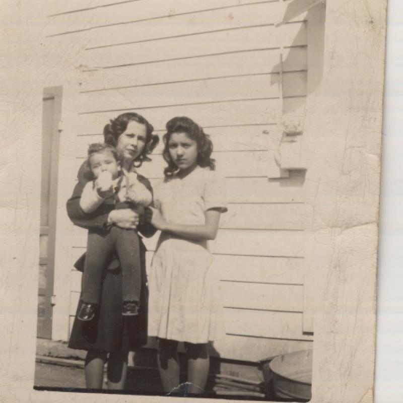 Henrietta Rivas holds her son Robert and poses with Nikie Garcia in 1947 in Charlotte, Texas. This photograph is part of the personal collection of Henrietta Rivas, one of many Latina participants serving the United States during WWII.